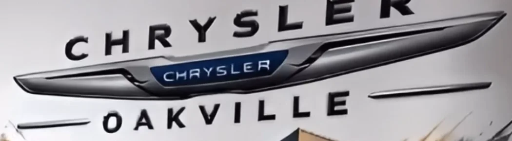 Close-up of a printed brand logo and lettering on a wall